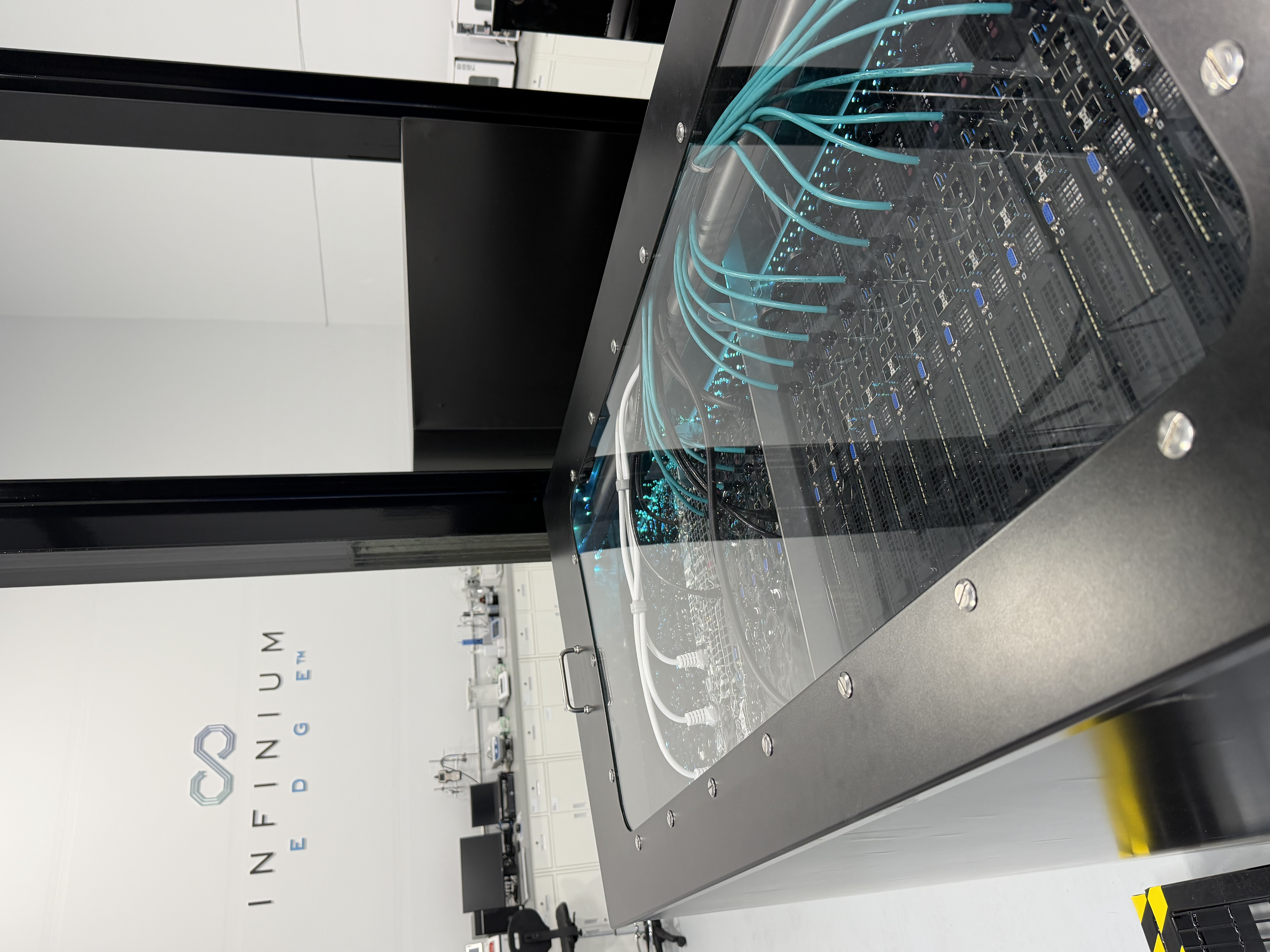 Infinium Edge platform tank with immersion-cooled servers